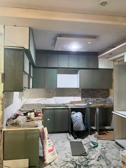 The cabinet boxes are in place. This stage is crucial for ensuring all measurements and alignments are perfect for the modular setup.