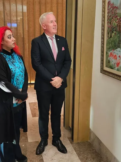 Mr. Ronan Fearon, the General Manager of JW Marriott, admiring the artworks at the 'Art Soirée'.