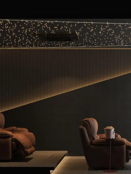 A duplicate of image 28, this view highlights the ambient lighting along the floor and wall, which guides the way without creating glare on the screen, enhancing the movie-watching experience.