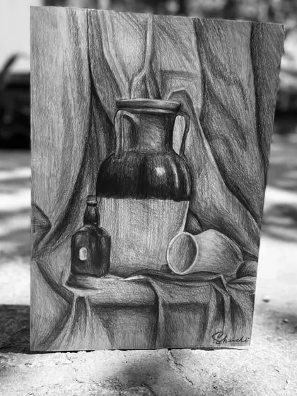 This beautiful still life sketch was made by my student Shuchi. Her work shows a great command of shading and composition, creating a sense of realism and depth using only graphite pencils.