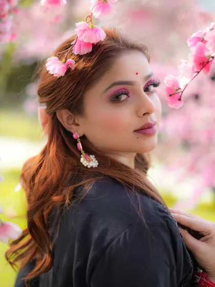 A different angle from the floral-themed shoot, focusing on the model's expression and makeup.