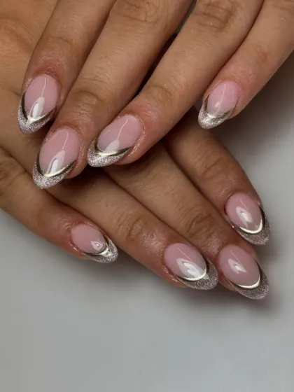 A full view of the stunning cat-eye French manicure with silver chrome outlines. The almond shape keeps the look sleek and sophisticated.