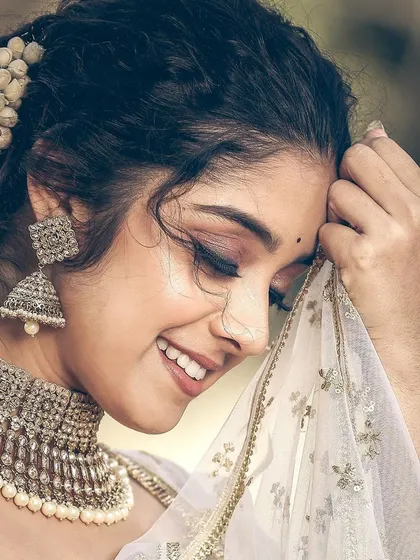 A beautiful, dreamy close-up of actress Ankita Amar. This soft glam look with a defined eye and nude lip is perfect for photoshoots or evening events.