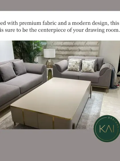 A modern grey sofa set paired with a sleek, minimalist coffee table. This arrangement was designed for a contemporary drawing room, creating a centerpiece that is both stylish and inviting.