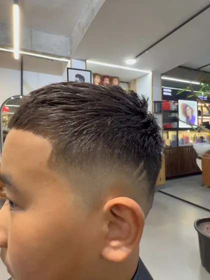 A close-up of the low fade, showing the seamless transition from the longer hair on top to the shorter sides.