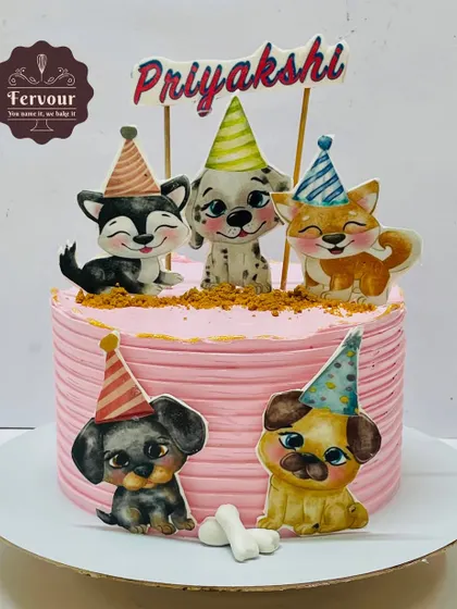 A puppy-themed cake for a pet lover. The pink cake is decorated with adorable edible images of puppies in party hats, making for a super cute birthday celebration.