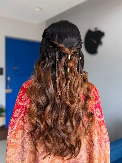 A detailed shot of the beautiful, bohemian-inspired hairstyle with soft waves and delicate braids.