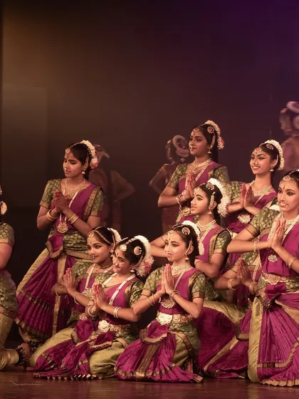 The entire group in a final pose of reverence. Every performance is an offering.