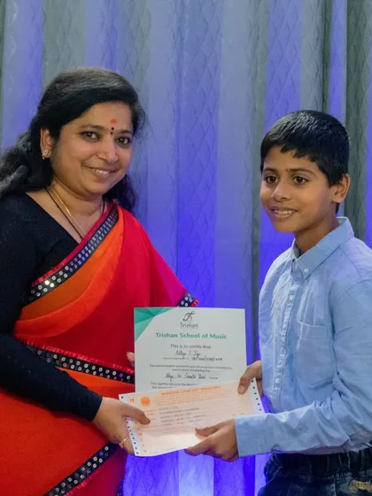 Congratulating a student on successfully completing his graded music exam. These certifications are a valuable addition to a student's musical education.