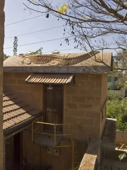 The "Prof's Residence" in Bengaluru, an early experimental project from 2003. It featured a universally accessible ground floor and a crocodile sculpture on its vaulted roof, serving as a laboratory for many of our design ideas.