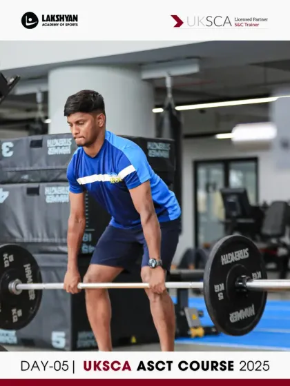 A participant demonstrates a deadlift during a practice session on Day 5, preparing for the upcoming strength assessment.