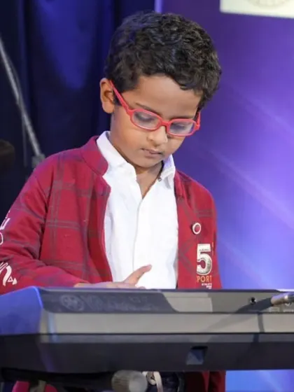 A collection of photos from our keyboard ensemble's performance of 'Chand Sifarish'. These shots capture the focus and joy of our young musicians and their teachers on stage.