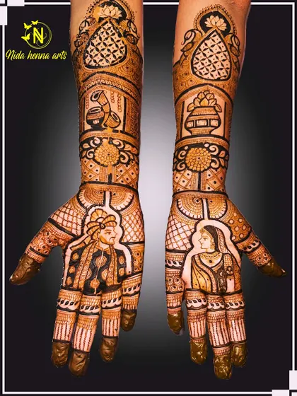 A simple yet elegant bridal design featuring portraits of the bride and groom on each palm. The design is complemented by traditional symbols like the kalash, showcasing a beautiful blend of personal and cultural elements.