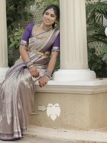 Vaishnavi looking graceful in her violet silk blouse with traditional zari borders.