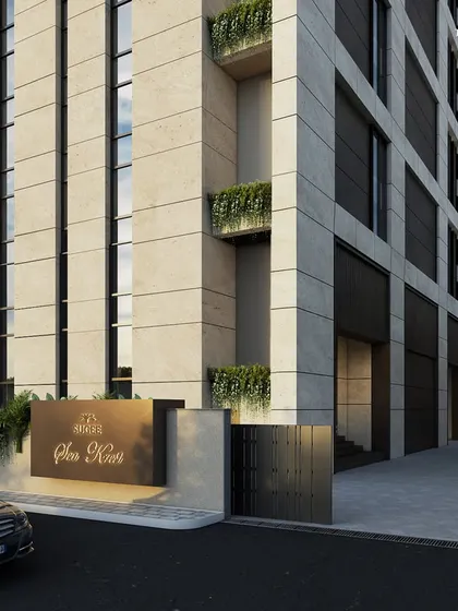 The entrance of our luxury Worli tower, where majestic heights and the finest materials create a sense of refined grandeur. Cascading greenery softens the design, adding a layer of life to the building's elegant elevation.