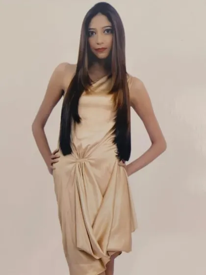 A professional shot of a model with a sleek, modern hairstyle. A sharp cut and expert styling can elevate your everyday look.