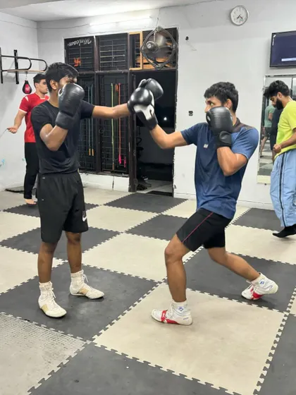 Two boxers work on their timing and distance with a simple jab drill. These fundamental exercises are the bedrock of good boxing.
