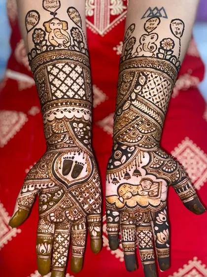 This baby shower mehandi is full of cute details, including baby footprints, a sleeping baby, and elephant motifs holding 'Baby Shower' balloons.