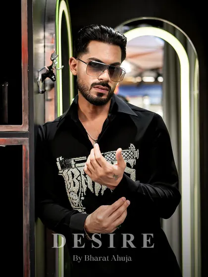 Confidence tailored, attitude stitched. This close-up captures the edgy vibe of the 'BAD BOYS' gun shirt.