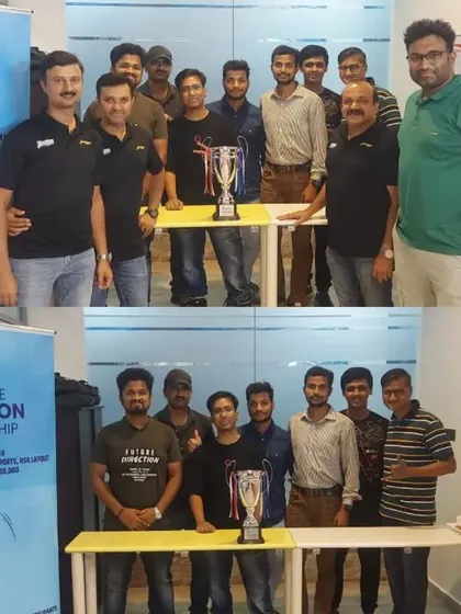 Team managers from various companies gather with the championship trophy before the Netflicks tournament begins. These pre event meetings are crucial for aligning on all logistical aspects.