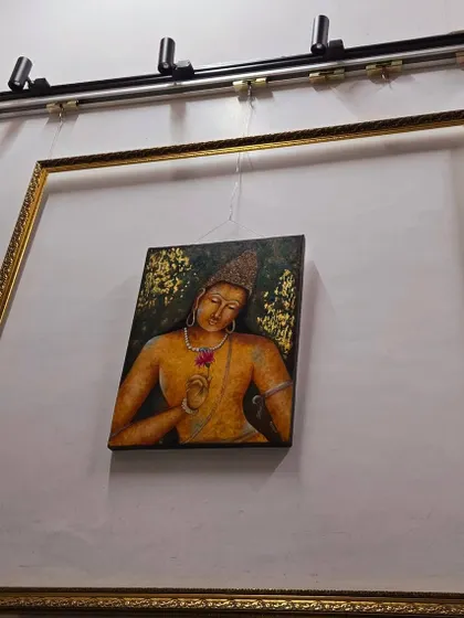 This painting of a divine figure, part of our "Vedic Vibrations" collection, is displayed within an empty frame to emphasize its preciousness. This unique presentation highlights the art itself as a jewel.