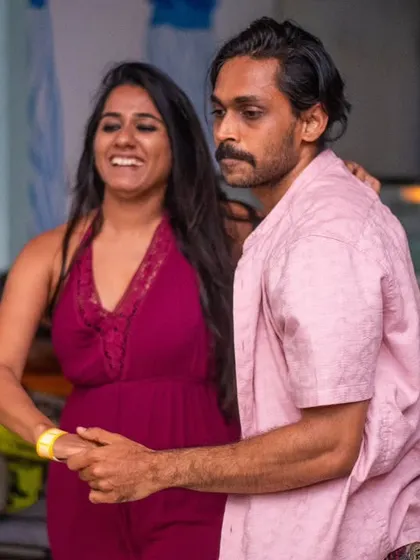 A relaxed and happy couple. The pink dress and pink shirt are a fun match.