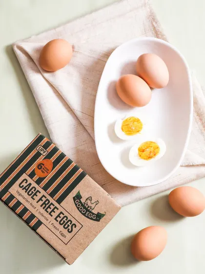 This lifestyle shot presents the eggs in a simple, rustic breakfast setting. The natural light and soft textures create a warm and inviting feel, helping customers imagine the product in their own kitchen.