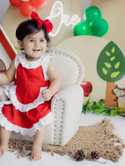 A big, happy smile from Little Red Riding Hood. We make sure our sessions are fun and interactive, so we can capture your child's most natural and joyful expressions.