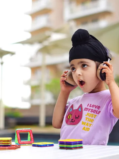 This expressive shot captures the fun of using the product, in this case, the headphones. Showing a child's genuine reaction is a powerful way to create engaging content for kids' brands.