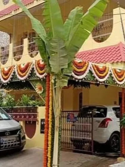 Even a simple *chappra* can make a house feel festive and ready for a *Gruha Pravesh*. This entrance features banana plants, a symbol of prosperity, and colorful marigold garlands, creating a warm, traditional welcome for family and friends.
