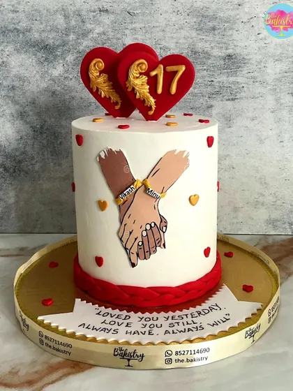 A romantic anniversary cake celebrating 17 years, with a "Loved you yesterday, love you still, always have, always will" message.
