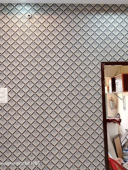 A simple but effective geometric wallpaper with a repeating diamond pattern.
