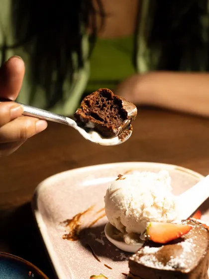 The perfect bite of the chocolate fondant on a spoon. This shot is all about showing the viewer what they're about to experience.
