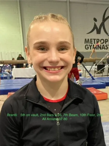 Brantli, a Level 7 gymnast, beams with pride after a fantastic performance that earned her 2nd place all-around.
