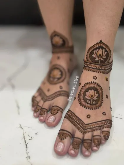 Straight from a Pinterest board! This trendy and beautiful foot design features a bold lotus mandala, creating a stunning focal point with a modern and clean feel.