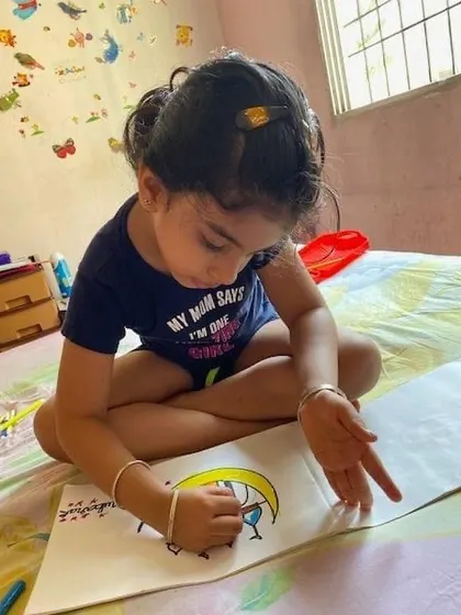 Even from home, our children's creativity shines. Here they are exploring different art techniques like spray painting and drawing, showing that learning and self-expression can happen anywhere.