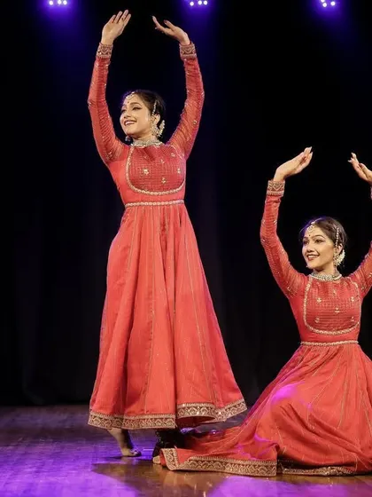 A moment of perfect symmetry in our Kathak duet. This pose, with arms raised in unison, highlights the precise coordination and shared understanding that comes from years of dancing together.