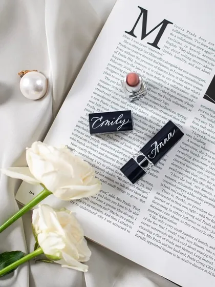 God is in the details. A collection of Dior lipstick cases, each engraved with a name. The precision required for such small items is a testament to years of practice.