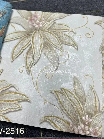 A sample from a wallpaper book showing a large, stylized floral design with a textured background.