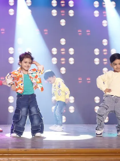 A candid moment of our toddlers on stage, each showing their unique personality. Our goal is to make their first performance experience positive and fun.
