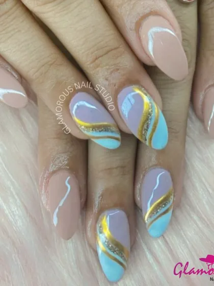 A beautiful combination of pastel colors and metallics. This design features abstract swirls of nude, baby blue, and gold glitter, creating a look that is both soft and glamorous.
