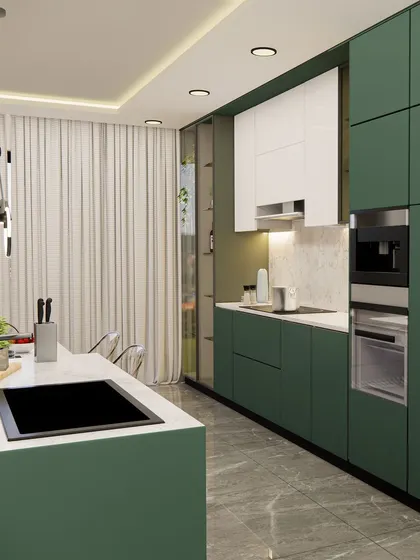 The long galley-style section of the kitchen features floor-to-ceiling cabinets in a bold green, providing extensive storage.
