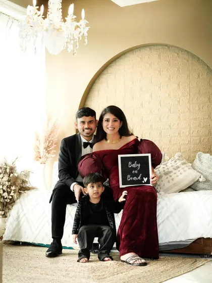 The whole family gathered on our studio bed setup, sharing a happy moment as they announce their wonderful news. These are the memories that become cherished stories.