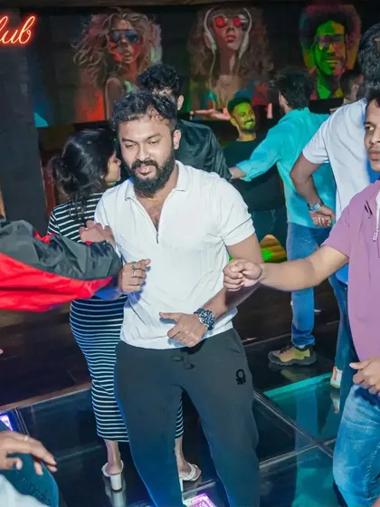 Guests letting loose on the illuminated dance floor at Boche Club. My sets are designed to make people forget their inhibitions and just dance.