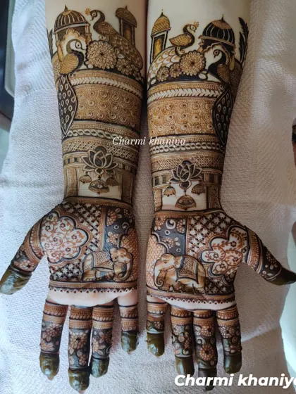A non-figure bridal mehendi that is full of royal charm. This design features peacocks, elephants, and lotus motifs, all woven together with intricate patterns for a truly grand look.