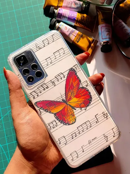 Here, I combined two of my favorite things: butterflies and music. This beautiful monarch butterfly is painted over a background of handwritten musical notes, creating a unique and artistic phone case insert.