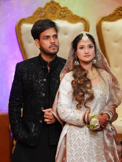 A formal portrait of the couple from their Nikaah or reception. The elegant attire and regal pose showcase the grandeur of the occasion.