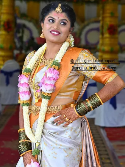 A confident pose from the bride, showcasing the elegance of the temple jewellery.