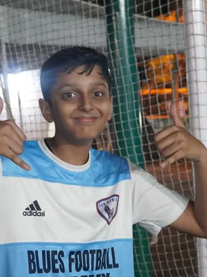 A happy player gives a thumbs up, showcasing the positive and fun environment we foster at the academy.