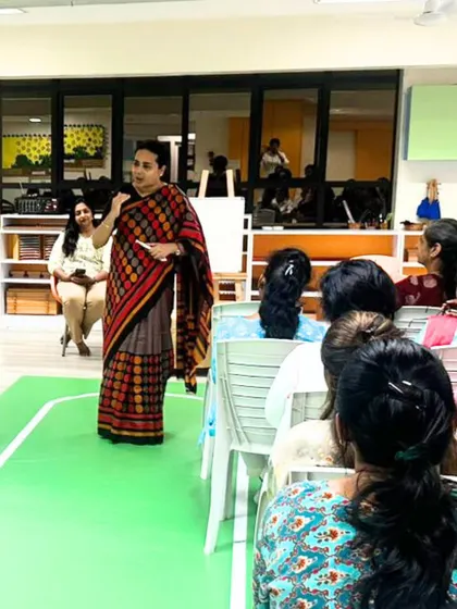 A teacher speaks during a training session, demonstrating our commitment to continuous improvement and reflective teaching.